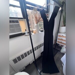 Long wide legged flattering jumpsuit with open back